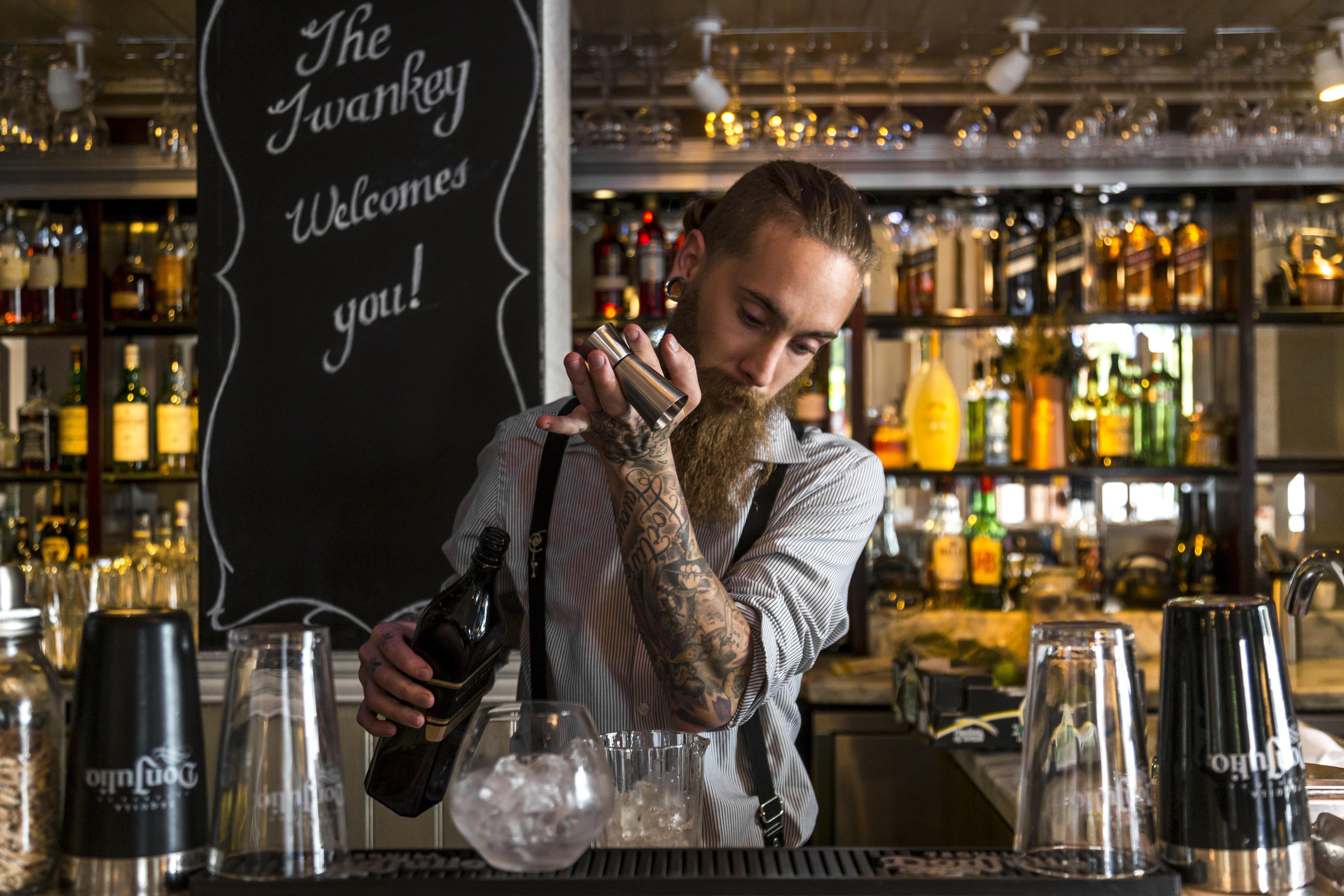 Taj Cape Town Hotel Bagian luar foto A bartender at work